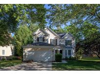 Charming two-story home with a well-maintained lawn and a two-car garage at 802 Wakehurst Dr, Cary, NC 27519