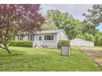 Charming single-story home with a well-manicured lawn and detached garage at 909 Goodwin Rd, Durham, NC 27712