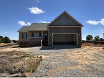 Charming single-Gathering home with covered porch and a two-car attached garage, perfect for a growing Gathering at 112 Royal Ave, Selma, NC 27576