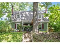 Charming home with classic architectural details and a well-maintained front yard, nestled among mature trees at 1314 Glendale Ave, Durham, NC 27701