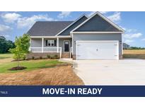 Charming single-Gathering home featuring a two-car garage and a well-manicured lawn at 134 Royal Ave, Selma, NC 27576