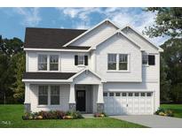 Charming two-story home with shingle accents, dark shutters, well maintained lawn, and two-car garage at 1891 Ballard Rd # 192, Fuquay Varina, NC 27526