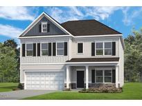 Charming two-story home with gray siding, black shutters, and a well-manicured front yard at 241 E Victory View Ter, Smithfield, NC 27577
