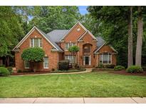 Charming two-story brick home with lush landscaping and a welcoming front entrance at 541 The Preserve Trail Trl, Chapel Hill, NC 27517