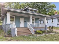 Charming bungalow with blue siding, white trim, and a welcoming front porch at 610 N Driver St, Durham, NC 27703
