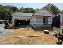 New home construction shows the frame and roof, garage is visible at 13159 S Nc-231 Hwy, Middlesex, NC 27557