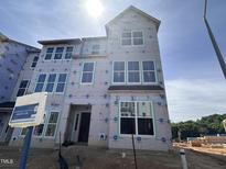 New construction home with large windows awaiting finishing touches and landscaping at 331 Chesapeake Cmns St # 106, Garner, NC 27529