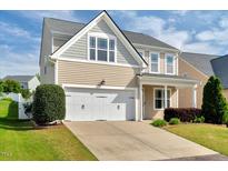 Charming two-story home featuring a two-car garage and well-maintained lawn at 4109 Massey Preserve Trl, Raleigh, NC 27616