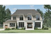 Stunning two-story home with a brick facade, elegant windows, and manicured landscaping at 4500 Latimer Rd, Raleigh, NC 27609