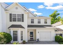 Charming two-story home with white siding, a well-manicured lawn, and an attached garage at 1 Edgebrook Cir, Durham, NC 27703