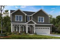 Charming two-story home featuring a welcoming front porch and a two-car garage, blending traditional and modern design elements at 174 Hickory Grove Dr, Sanford, NC 27330