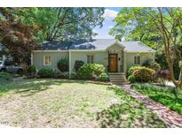 Charming single-story home with well-maintained lawn and mature trees at 2823 Fowler Ave, Raleigh, NC 27607