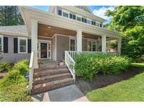 Charming home featuring a covered front porch with brick steps and well-maintained landscaping at 30119 Settle, Chapel Hill, NC 27517
