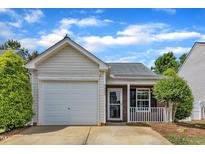 Charming single-Gathering home featuring a one-car garage, brick accents, and a well-maintained front yard at 5420 Roan Mountain Pl, Raleigh, NC 27613