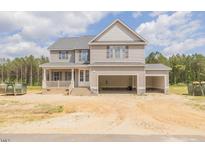 New two story construction with a two car garage and beautiful siding at 66 Sanders Farm Dr, Smithfield, NC 27577