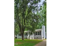 Charming single-story home with a classic gray exterior, white trim, and a welcoming front porch at 81 Honeysuckle Dr, Pittsboro, NC 27312