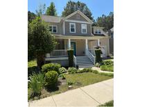 Charming two-story home with a welcoming front porch and well-maintained landscaping at 102 Kipling Dr, Oxford, NC 27565