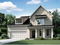 Charming two-story home featuring neutral siding, black roof, and a manicured front lawn at 1309 Sparkling Lk Dr # 38, Apex, NC 27523