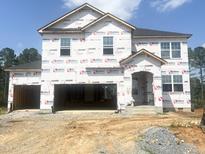 Two-story home with builders wrap and black roof; awaiting finishing touches at 236 Golfview Ave, Benson, NC 27504