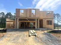 Image of a new construction home showing the framed exterior and roof against a blue sky at 236 Golfview Ave, Benson, NC 27504