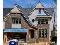 New construction two-story home featuring brick and siding exterior at 3008 Eden Harbor Ct, Raleigh, NC 27613