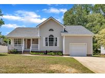 Charming single-Gathering home with a well-manicured lawn, porch, and attached garage in a suburban neighborhood at 316 Waterford Dr, Clayton, NC 27520