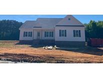 Charming single-story home with a symmetrical facade, gabled roof, and neat landscaping at 519 Mulberry Rd, Spring Hope, NC 27882