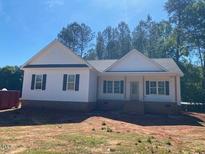 New construction one-story home with white siding and black shutters at 539 Mulberry Rd, Spring Hope, NC 27882