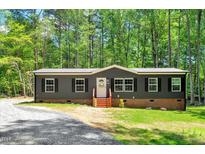 Charming single-story home with a well-maintained lawn and classic curb appeal at 6082 Zachary Lane Ln # 1S, Oxford, NC 27565