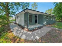 Charming single-story home featuring a freshly painted exterior and a cozy front porch at 308 Lynn Road, Durham, NC 27703