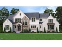 Stunning two-story home featuring stone and white brick with professionally landscaped front yard at 35 Big Bear Dr, Pittsboro, NC 27312