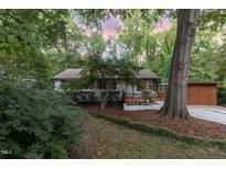 Charming single-story home with a landscaped front yard and welcoming entry porch at 421 Ridgefield Rd Rd, Chapel Hill, NC 27517
