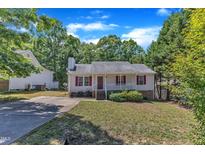 Charming single-story home with red shutters, a cozy front porch, and a well-maintained lawn at 4533 Whistling Way, Raleigh, NC 27616