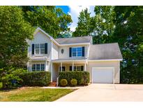 Charming two-story home with landscaped yard and attached one car garage at 716 Lakeview Ave, Wake Forest, NC 27587