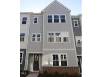 Charming two-story home featuring a modern design and neutral color palette at 806 Hillfarm Dr, Wake Forest, NC 27587