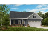 Charming single-Gathering home with a manicured lawn, attached garage and inviting front entrance at 2021 Clydner Dr, Apex, NC 27523