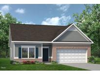 Charming one-story home featuring a brick facade, attached garage, and manicured lawn at 48 Spirit Springs Rd, Smithfield, NC 27577