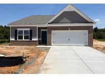 New construction home with a brick facade and a two-car garage, offering modern living at 48 Spirit Springs Rd, Smithfield, NC 27577