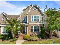 Charming home with a stone facade, complemented by manicured landscaping and a welcoming entrance at 49 Salt Cedar Ln, Chapel Hill, NC 27516