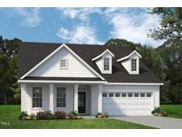 Charming new construction home featuring a welcoming two-car garage and manicured lawn at 702 Beacon Hill Rd # 51, Lillington, NC 27546