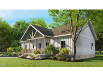 Charming home featuring white siding, a cozy front porch, and beautifully landscaped surroundings at 3188 Williams Ln, Graham, NC 27253