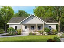 Charming single-story home with a welcoming front porch and lush landscaping at 3188 Williams Ln, Graham, NC 27253
