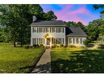 Charming two-story home features a well-manicured lawn, landscaped yard, and inviting front entrance at 540 W Juniper Ave, Wake Forest, NC 27587