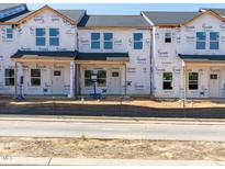 New construction townhomes with Tyvek wrap, ready for customization and finishing touches at 715 Chandler Stone Dr, Zebulon, NC 27597