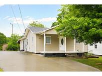 Inviting exterior showing the front of the home with a cozy front porch and well-maintained yard at 1309 Jackson St, Burlington, NC 27217