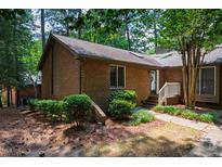 Charming brick home with well-maintained landscaping and inviting front entrance at 200 W Woodcroft Pkwy # 52A, Durham, NC 27713