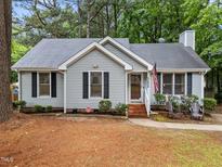 Charming single-story home featuring a cozy front porch, neat landscaping, and a welcoming facade at 3608 Meadow Creek Ln, Raleigh, NC 27616