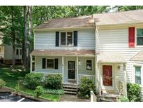 Charming townhome with a cozy front porch and beautiful landscaping at 6685 English Ivy Ln, Raleigh, NC 27615