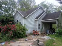 Exterior view of the home showcasing its architecture and surrounding landscape at 1036 Altice Dr, Raleigh, NC 27603