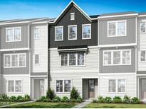 Charming townhome showcasing a well-maintained lawn and inviting facade at 1038 Zelkova Ln, Chapel Hill, NC 27517